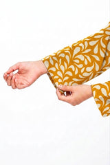 Plum Khaddar Mustard Colour printed White Patterns with Mustard buttons on 2pc stitched suit for Girls.