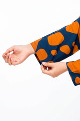 Plum Lilen (imported fabric) Teal Colour printed Light Orange patterns with Light Orange buttons on 2pc stitched suit for Girls.